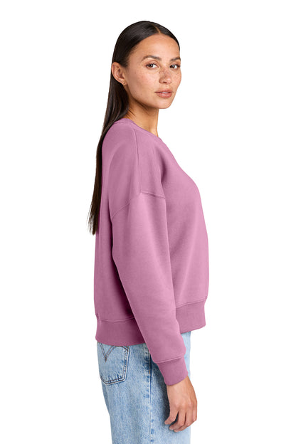 Stanley/Stella Women’s Stella Alma Crewneck Sweatshirt in Bubble Pink, side on model