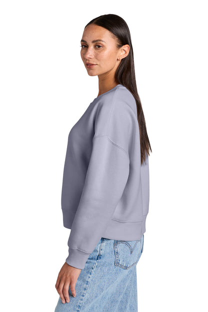 Stanley/Stella Women’s Stella Alma Crewneck Sweatshirt in Lavender, side on model