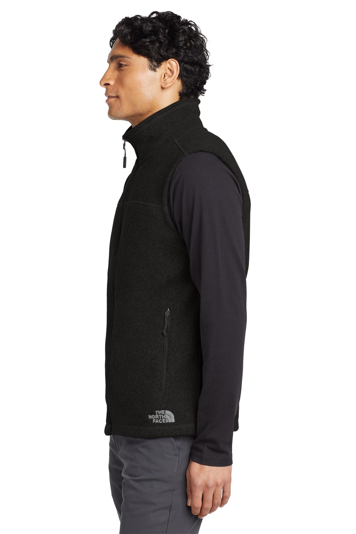 The North Face Sweater Fleece Vest in TNF Black Heather, side on model