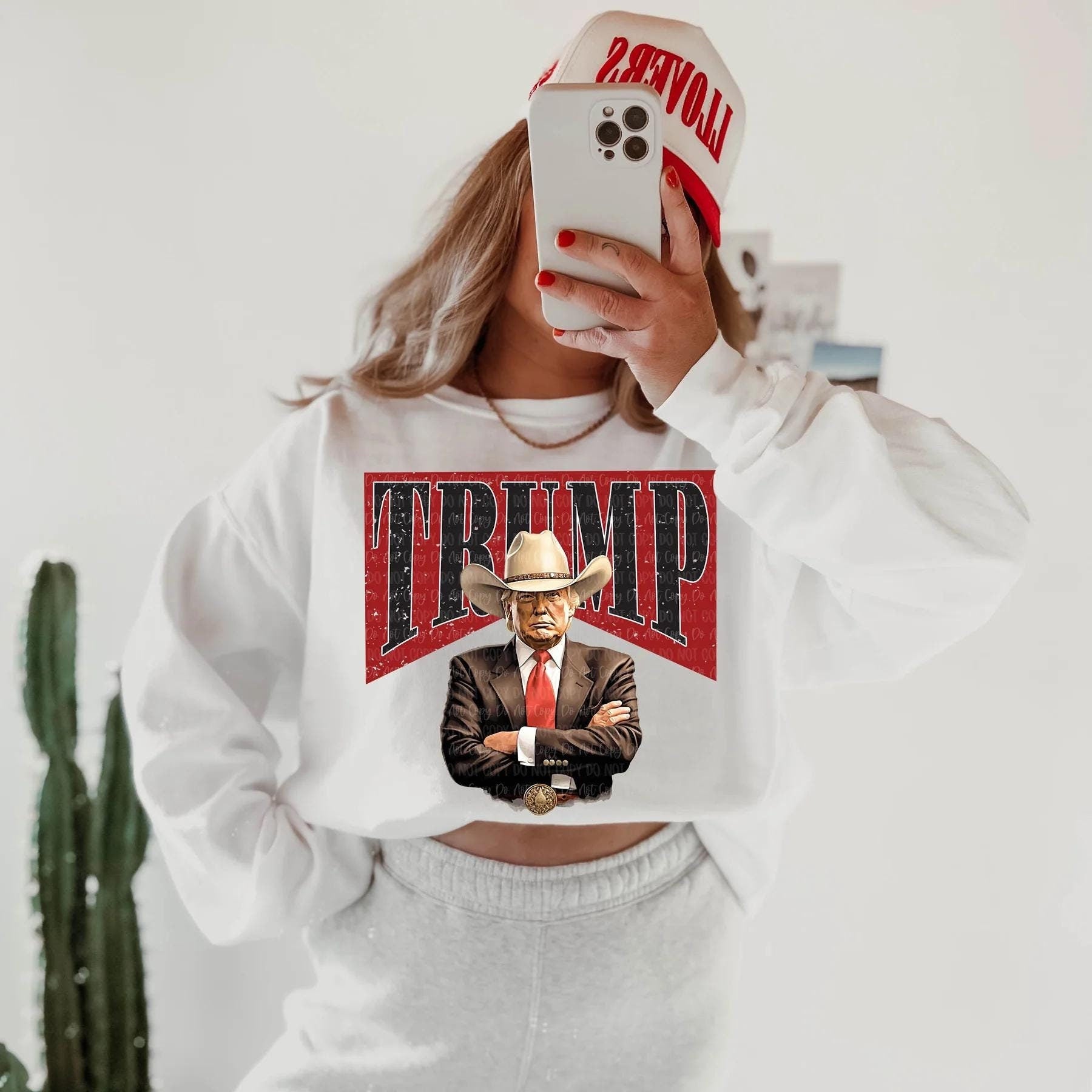 Cowboy Trump Graphic Shirt – Bold ‘TRUMP’ Background Design, T-shirt, Sweatshirt, Hoodie