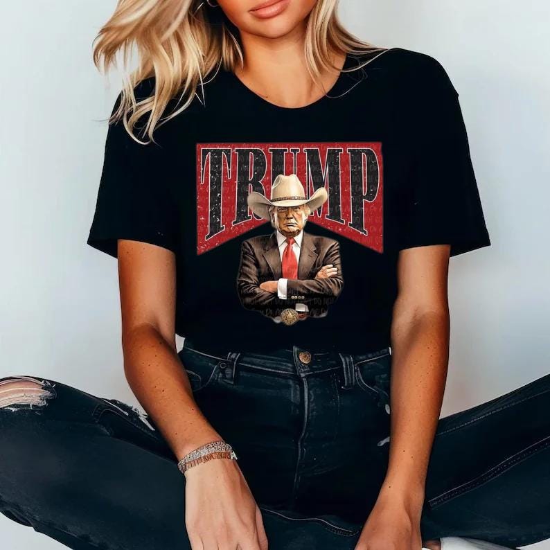 Cowboy Trump Graphic Shirt – Bold ‘TRUMP’ Background Design, T-shirt, Sweatshirt, Hoodie